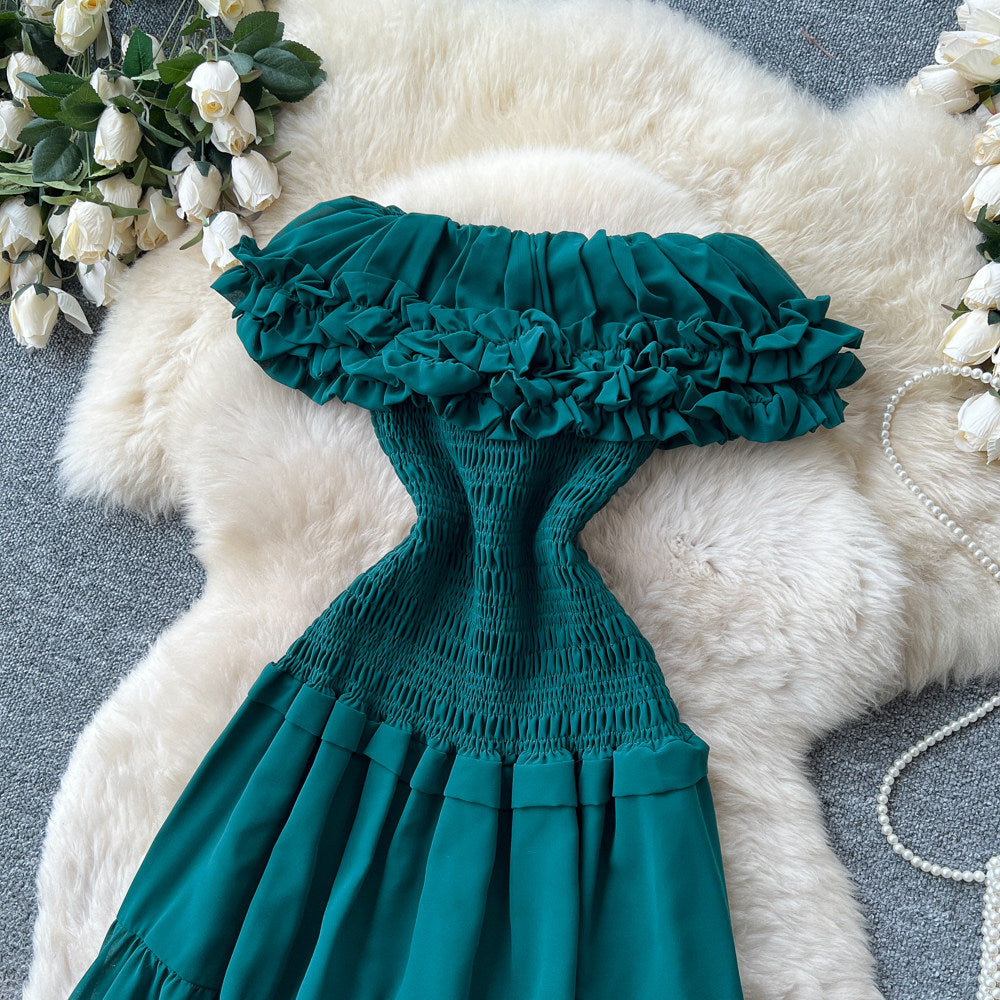 French-inspired, strapless, and stylish dress for women. high-waisted, slimming, and featuring a flattering ruffle hem. perfect for summer, this long, flowing dress comes in a chic green