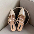 Frenchclassy sense of rivets toe-cap half slippers for women spring and summerflatsoutwear2025k-style patent leather pointed toe sandals