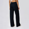 High-waisted, straight-leg pants with a drawstring waistband. versatile and casual, these long pants are designed to elongate the legs with a relaxed, wide-leg fit. perfect for running and workouts. style d25048