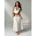 Women's embroidered v-neck sleeveless top and high-waisted a-line maxi skirt two-piece set, perfect for a stylish vacation look