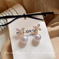 Sparkling butterfly pearl front and back two-wear stud earrings for women 2026 new arrivalniche stylesense of design earringselegant earrings