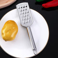 Stainless steel multi-purpose vegetable peeler & slicer - shreds potatoes, onions, radishes, and cucumbers - kitchen gadget