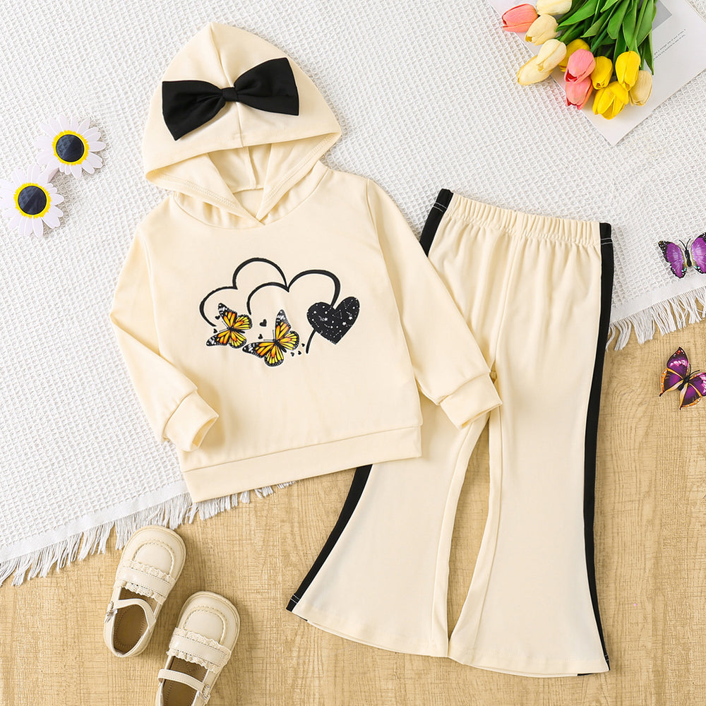 Girls' autumn outfit: beige hooded sweatshirt with cartoon print and bow detail, paired with flared pants