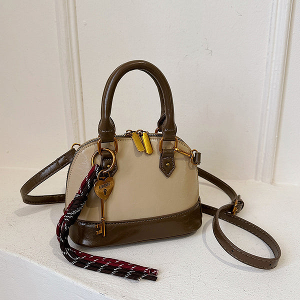 Super fire exquisite mini portable shell small bag women's 2025 new light luxury niche high-end messenger bag