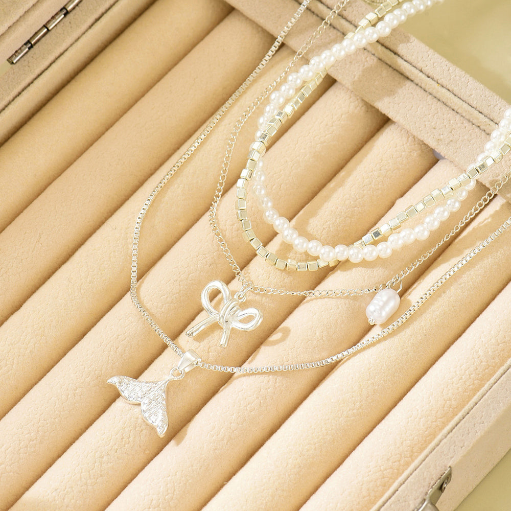 Wholesale diamond-studded mermaid tail bow pendant necklace - european & american cross-border, light luxury, high-end style - women's layering necklace with faux pearl accents