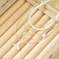 Wholesale diamond-studded mermaid tail bow pendant necklace - european & american cross-border, light luxury, high-end style - women's layering necklace with faux pearl accents