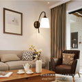 Retro iron curved pole bedside off-white tapered b&b guest room hotel bedroom stairwell casual reading wall lamp