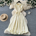 French sleeveless tie-up a-line tulip dress - women's summer high-waisted cinched waist tie detail flowy luxury work dress