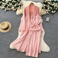 Minimalist solid color knitted mature woman's winter set: slim-fit bandeau dress with long cardigan coat