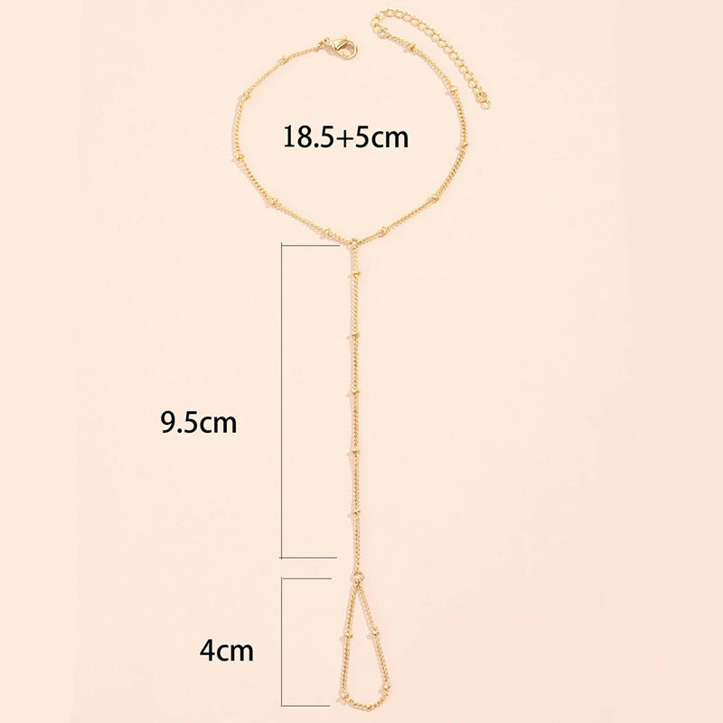 European and american new arrival versatile jewelry: minimalist white pearl bracelet, women's butterfly finger chain bracelet - wholesale from manufacturer