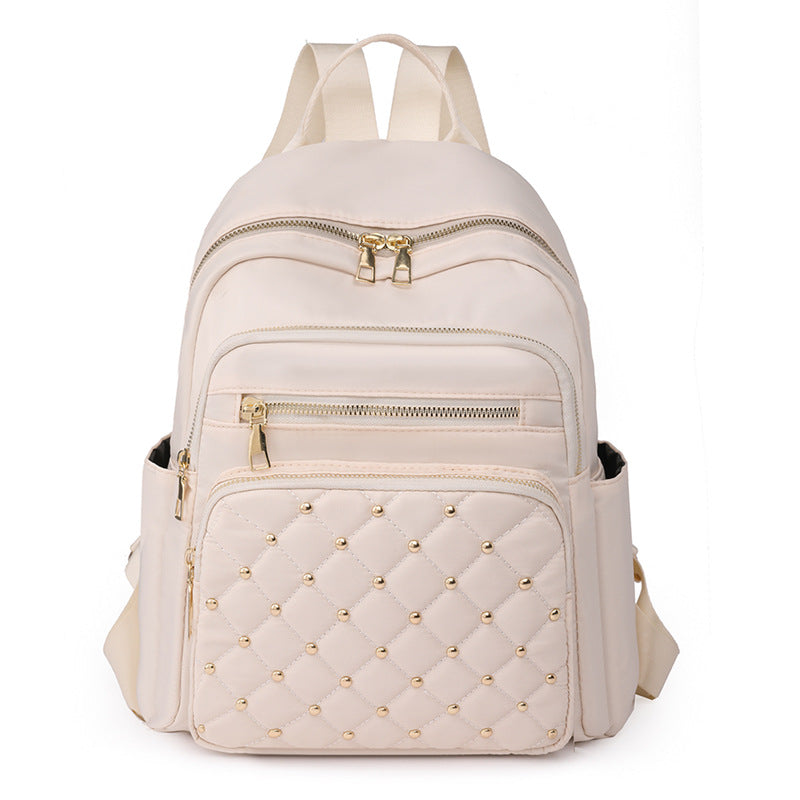 Solid color rhombus sewing line rivets fashion backpack women's 2025 texture Korean version large capacity simple women's backpack