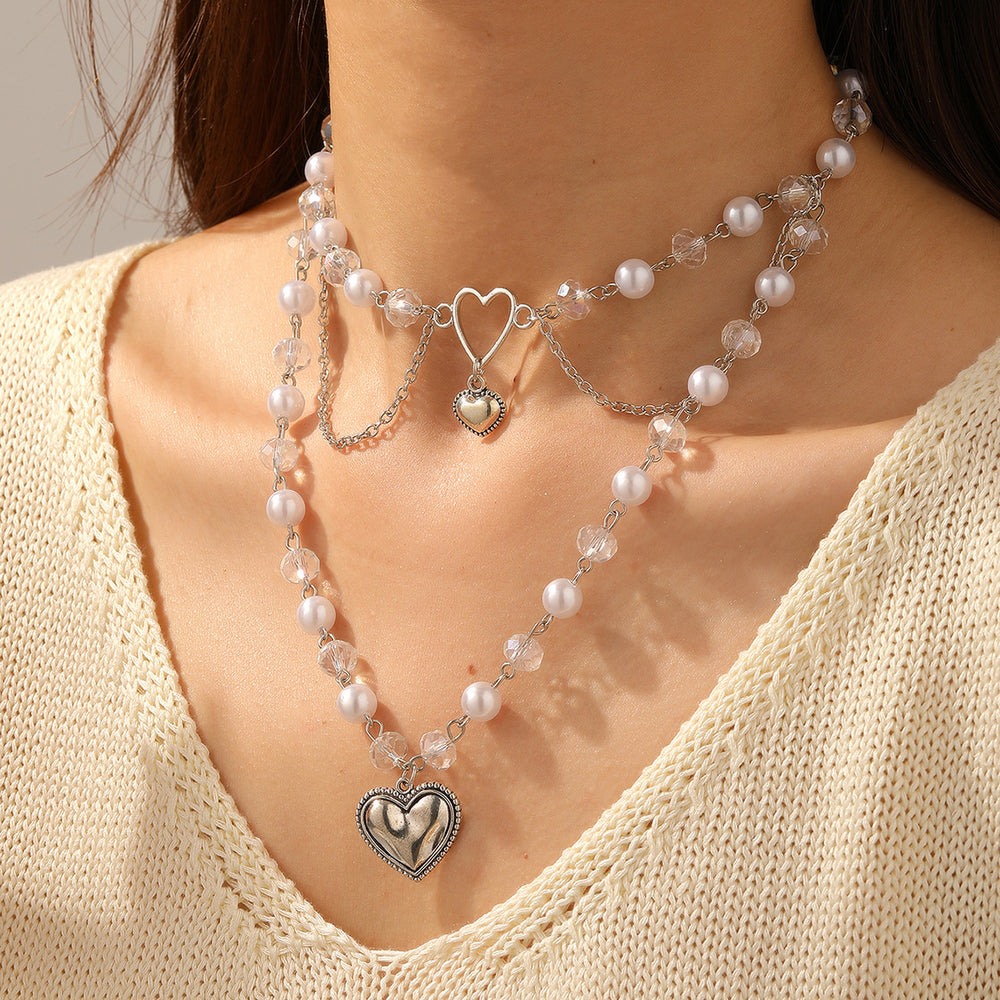 Wholesale faux pearl chains: cross-border fashion, niche, high-end, gothic style heart pendant necklace, sweater chain accessories