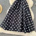 French high-end women's dress - autumn  collection: elegant bow-embellished camisole dress with cinched waist, flared hem, and polka dot detail - a flattering, flowy maxi dress
