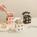 Luxury nordic-style heart-shaped ceramic utensil holder with stainless steel fruit tea spoons – perfect for afternoon tea and dessert forks