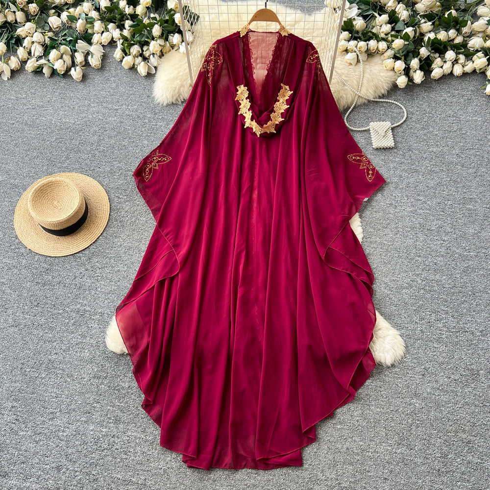 French-style, heavily embellished beaded v-neck hooded dress for women, perfect for spring. features a wine-red, asymmetrical hemline, exuding a sophisticated and elegant vibe