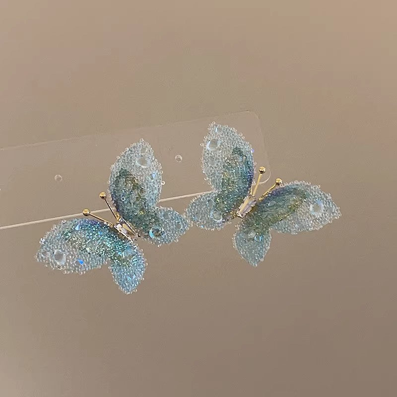 High-end, ethereal gradient 3d butterfly stud earrings for women. unique, niche design, fashionable, elegant, and versatile