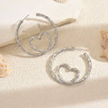 Wholesale gold earrings: european & american cross-border jewelry accessories - new, niche, light luxury, high-end, minimalist hoop & heart drop earrings for women