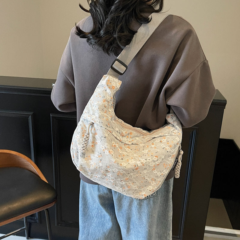 Foreign order niche floral dumpling bag women's 2025 new versatile shoulder bag versatile large-capacity casual messenger bag