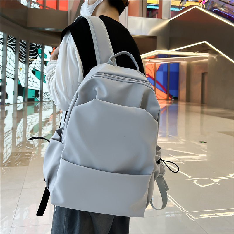 Campus Japanese backpack versatile male and female junior high school college student schoolbag solid color casual large capacity travel backpack