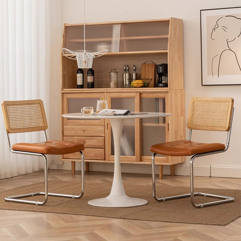 Rattan dining chair - luxury, high-end design with curved backrest - modern minimalist woven rattan chair