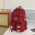 Minimalist korean style fashion casual backpack for high school and college students, featuring cute cartoon badges and large capacity