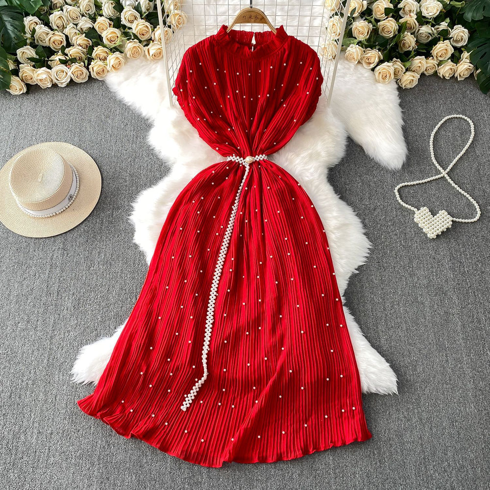 Elegant and sophisticated, this heavy-beaded, ruffled-edge, round-neck dress is a stunning new addition to your summer wardrobe. designed to flatter, it features a cinched waist and a slimming silhouette, finished with a pleated maxi skirt