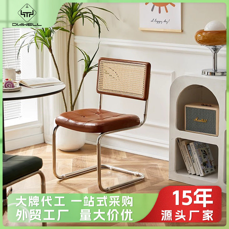 Rattan dining chair - luxury, high-end design with curved backrest - modern minimalist woven rattan chair