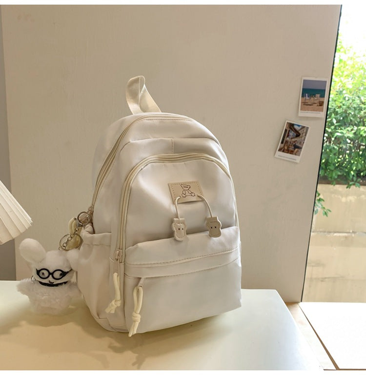 School bag female college student Korean version ins solid color simple and versatile junior high school student travel small backpack high school student backpack