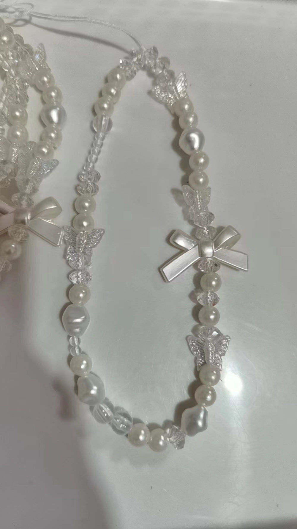 Minimalist pearl white heart bracelet with gauze bow and bear charm - phone lanyard accessory