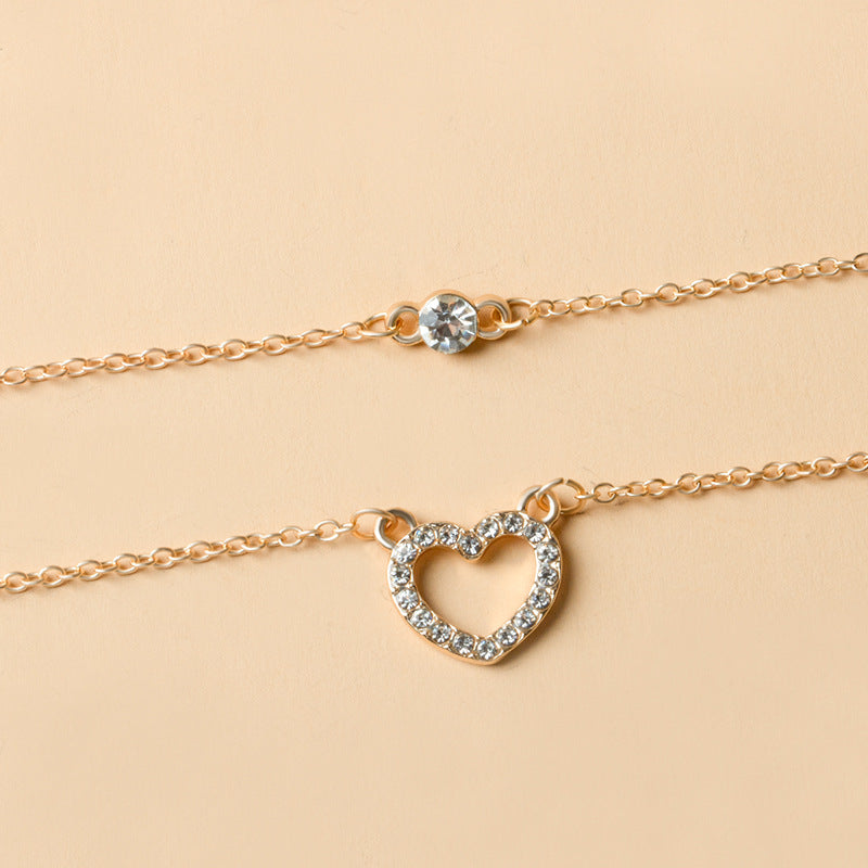 Wholesale heart necklaces: versatile european & american style jewelry, hollow-carved, diamond-accented, multi-layered alloy choker necklace - trendy ins style