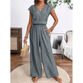 Women's v-neck short sleeve jumpsuit with button-front, elastic waist, wide leg, and pockets - perfect for everyday casual wear