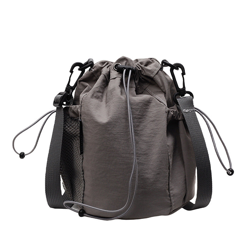 New drawstring bundle hand carry bucket bag  simple casual versatile shoulder bag outdoor commuter messenger women's bag