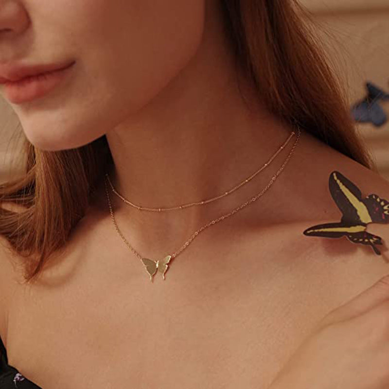 Amazon new jewelry butterfly pendant double layer rice beads butterfly necklace casual daily butterfly necklace