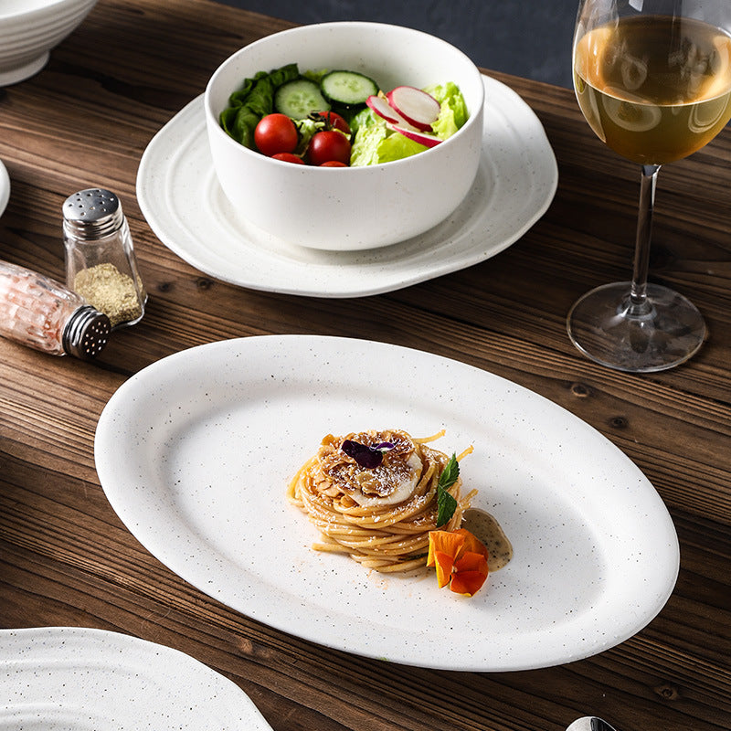 Minimalist blue and white polka dot ceramic bowls, plates, and dishes - perfect for home, restaurant, western cuisine, steak, high-end hotel, and unique dessert presentation