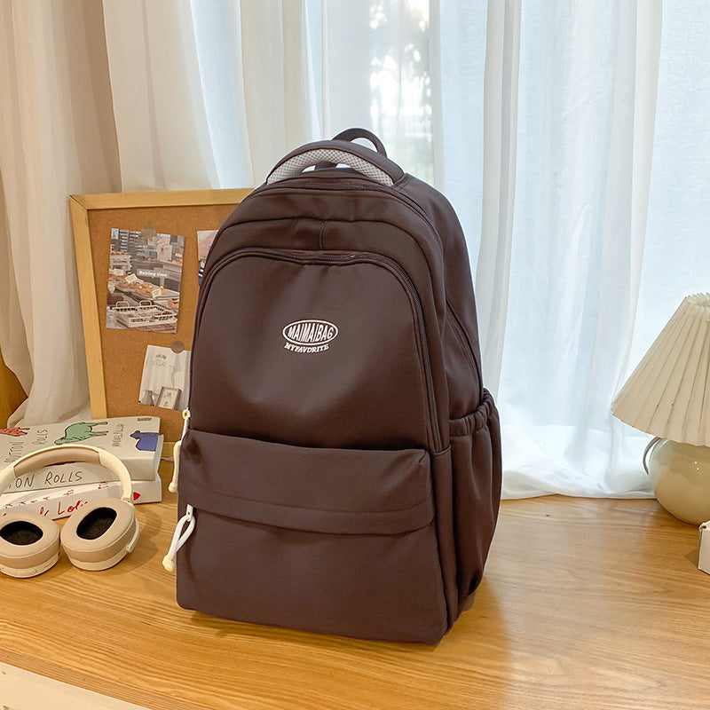New schoolbag large capacity water-resistant embroidered backpack for junior and senior high school students - solid color, simple, and cute design