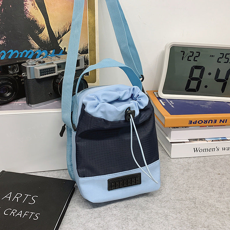 Foreign trade cute contrasting color draw belt small bag women 2025 new versatile sports and leisure shoulder messenger bag cloth bag