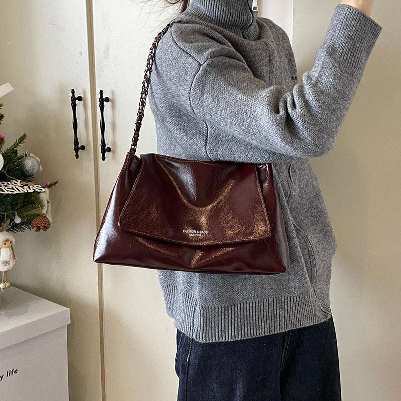 Solid color simple large-capacity foreign gas bag women's 2025 new trendy underarm commuter chain single shoulder tote bag