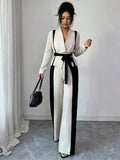 minimalist color block two-piece set: v-neck, tie-waist jacket with black and white wide-leg pants