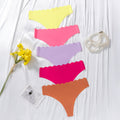 European and american  low-waist seamless ice silk underwear one-piece adhesive pure color cut out wavy waist women's underwear