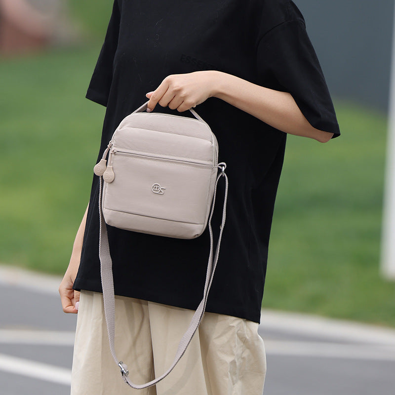 Cross-border high-end bag women's summer 2025 new fashion messenger bag Korean version cloth bag popular portable small backpack