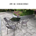 Outdoor table and chair set with umbrella, sunshade, perfect for outdoor cafes, bubble tea shops, and casual outdoor seating. features a wrought iron frame and rattan chairs, ideal for patios and gardens