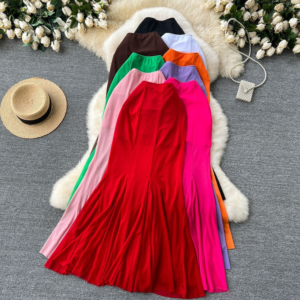 High-end, sophisticated, and effortlessly chic: this versatile midi skirt is perfect for the modern woman's commute. featuring a stylish design with elastic detailing, a figure-flattering fit, and a trendy mesh and fishtail hem, this skirt is a must-have