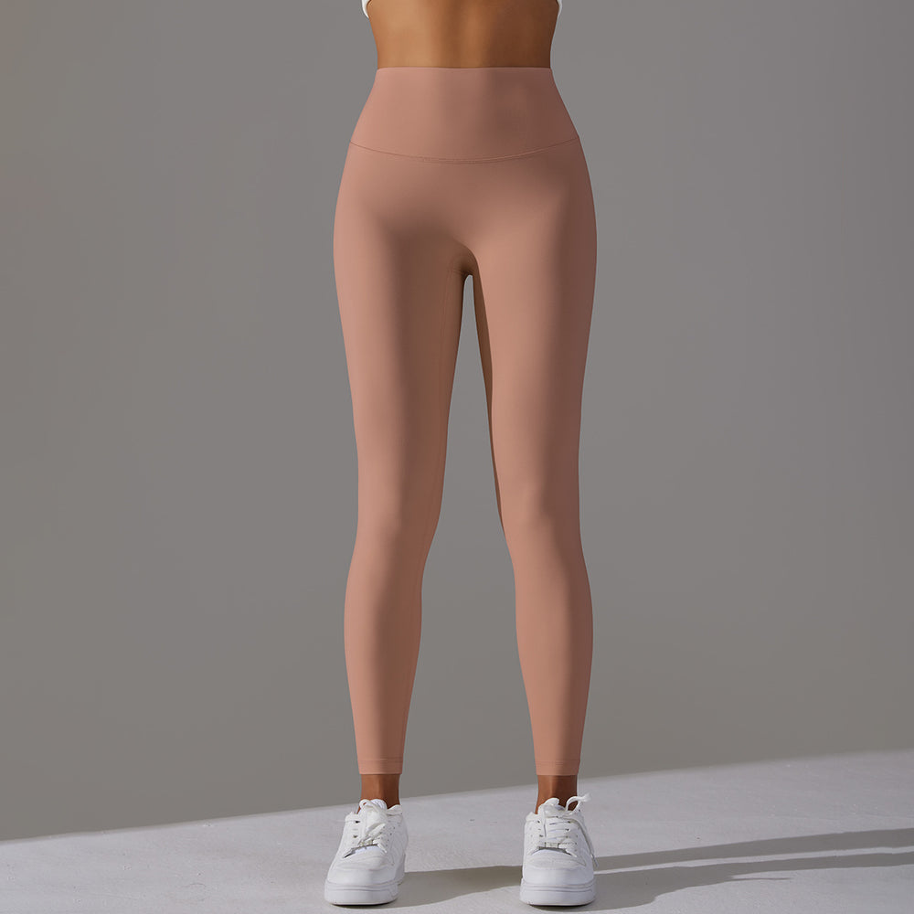 High-waisted, barely-there yoga pants for women, designed with a no-ride-up waistband for a seamless look. these figure-hugging, peach-shaped leggings offer a lift and a comfortable, stretchy fit, perfect for workouts and fitness activities. custom manufa