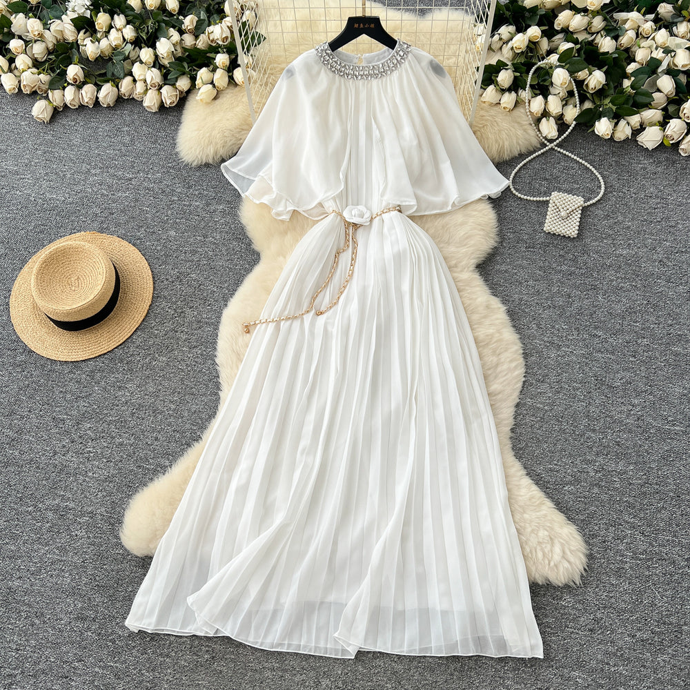 French-style, heavily embellished, beaded and rhinestone-studded, round-neck shawl dress with tie-waist detailing. features a flattering, slimming silhouette and elegant pleated chiffon