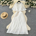 French-style, heavily embellished, beaded and rhinestone-studded, round-neck shawl dress with tie-waist detailing. features a flattering, slimming silhouette and elegant pleated chiffon