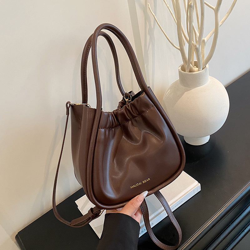 Foreign order high-quality texture foreign gas bucket bag women's 2025 summer new fashion commuter shoulder portable messenger bag