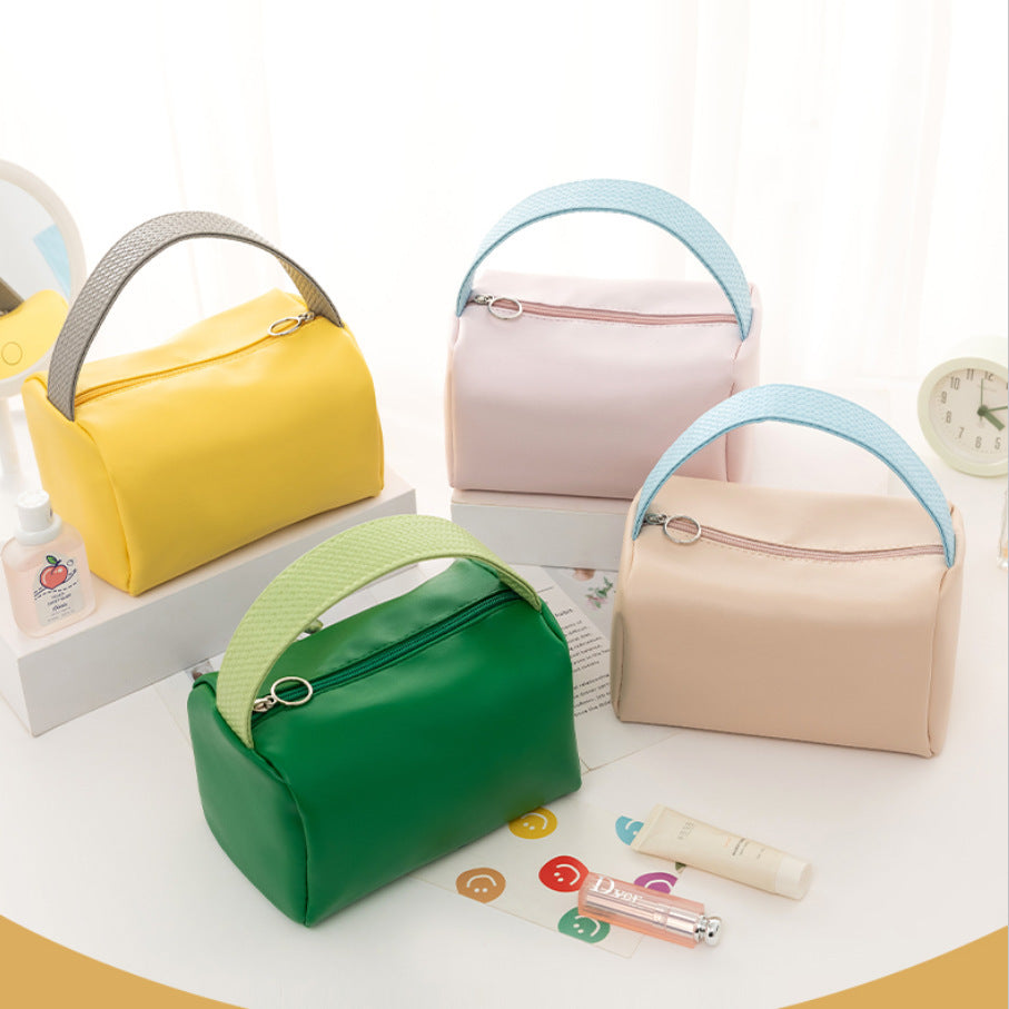 Portable cosmetic bag, new candy color, large-capacity storage bag, finishing bag, cosmetics, portable toilet bag, wholesale.