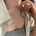 Fashionable, understated luxury: a delicate, double-layered teardrop titanium steel necklace for women. a versatile, minimalist collarbone chain that's trendy, stylish, and fade-resistant
