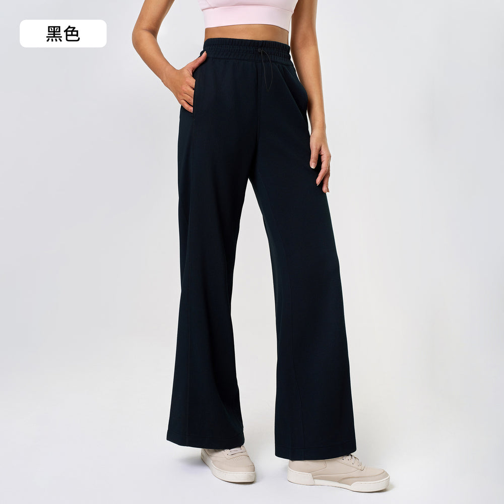High-waisted, straight-leg pants with a drawstring waistband. versatile and casual, these long pants are designed to elongate the legs with a relaxed, wide-leg fit. perfect for running and workouts. style d25048