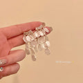 French chic seashell tassel earrings - exquisite, high-end, beachy vacation style studs - stunning statement earrings